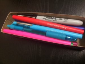DIY Storage Container with pens, pencils, and markers inside.